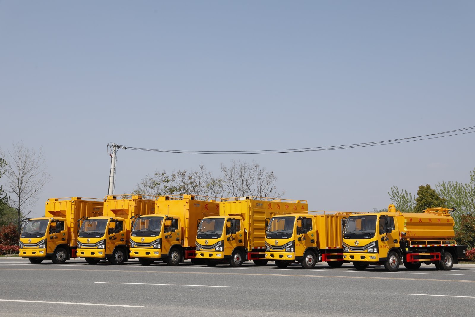 Yellow suction trucks prepared for special application delivery